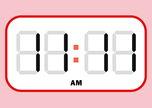 Digital clock display with time 11:11 AM angel time on a pink background