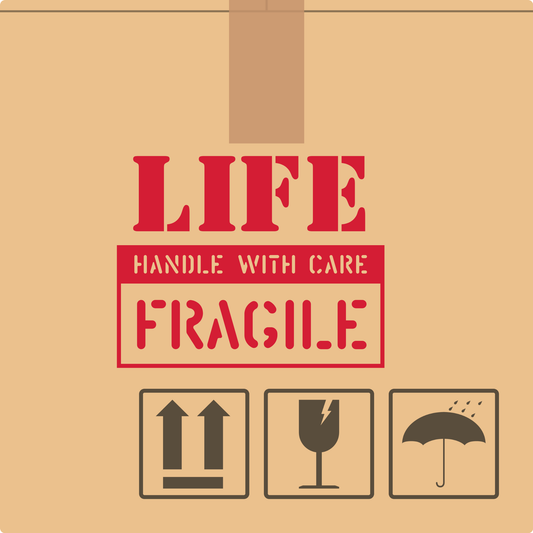 cardboard box image with life is fragile handle with care written in red on the side of the box