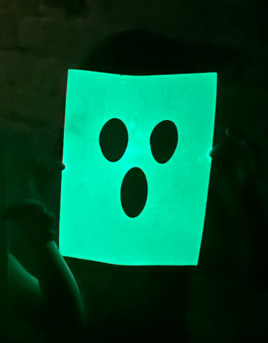 Glowing Halloween-themed designs on a dark background