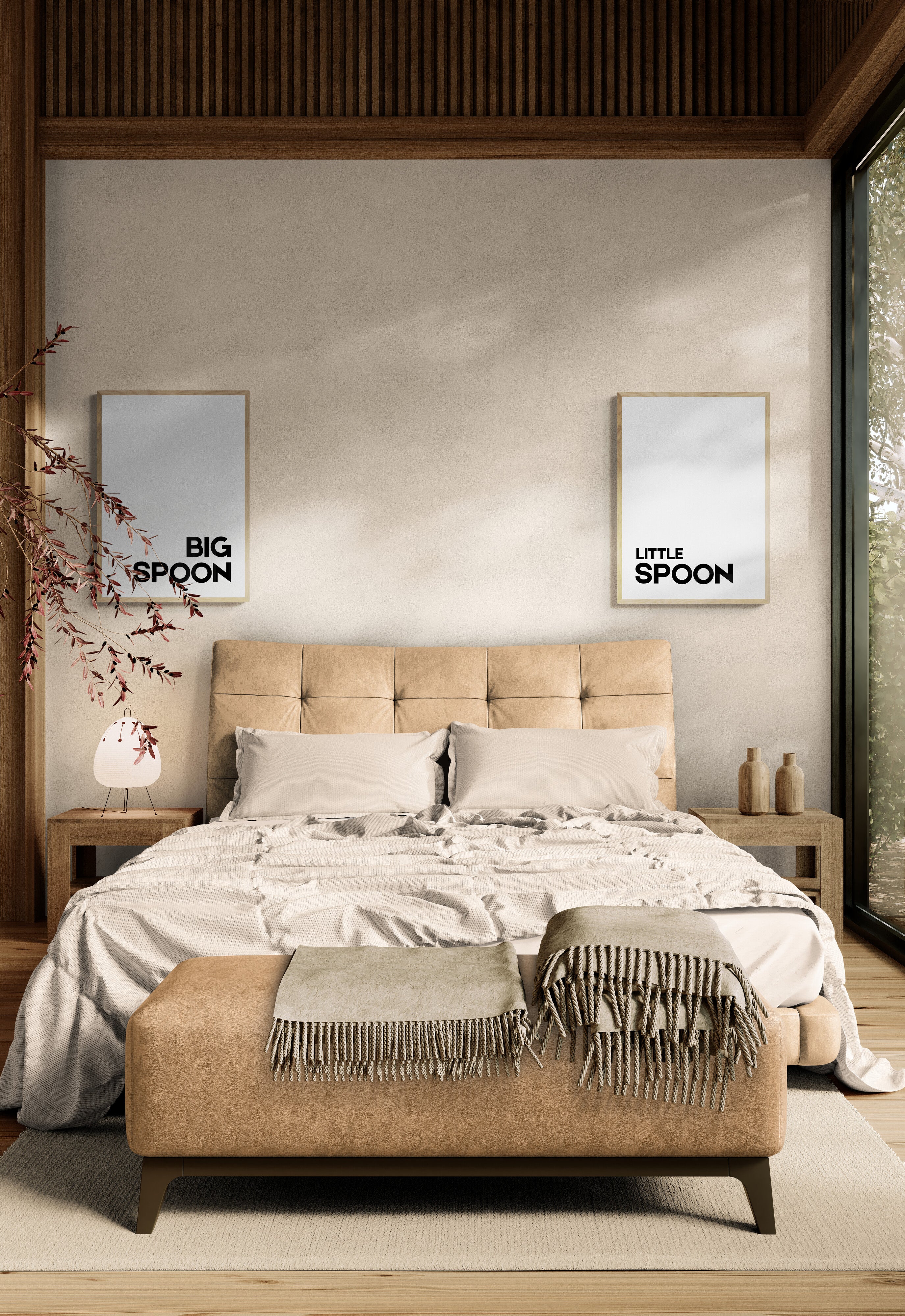 Two prints either side of the bed one saying big spoon the other saying little spoon in bold font on a white background