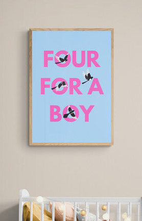 Framed poster with 'FOUR FOR A BOY' text and four magpies positioned on it in a nursery setting