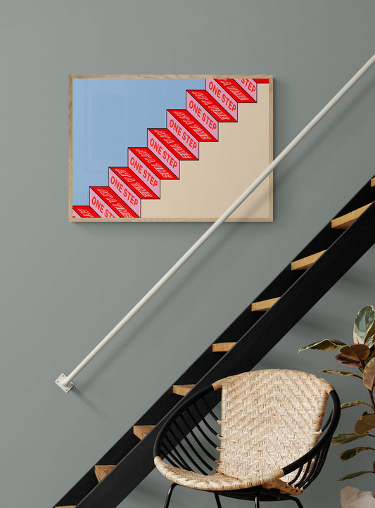 Framed print with a staircase and the wording one step at a time as you go up the steps